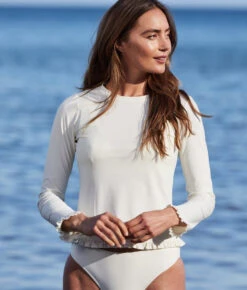 The Waterside Ruffle Rash Guard - White Sand -Summersalt Shop WatersideRuffleRashGuardWhiteSandLifestyle2